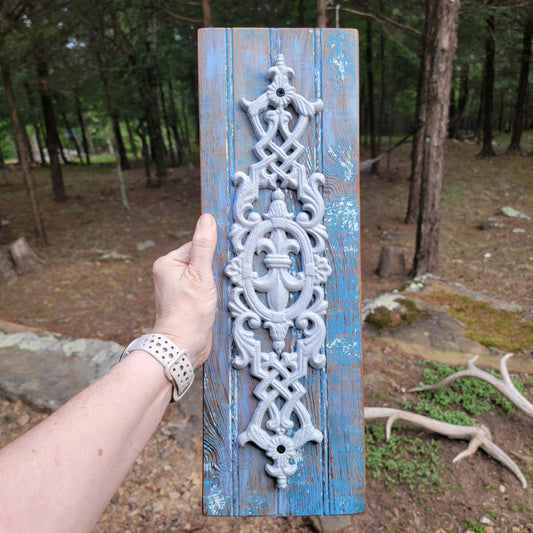 White Cast Iron Medallion on Reclaimed Blue Wood