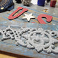 White Cast Iron Medallion on Reclaimed Blue Wood